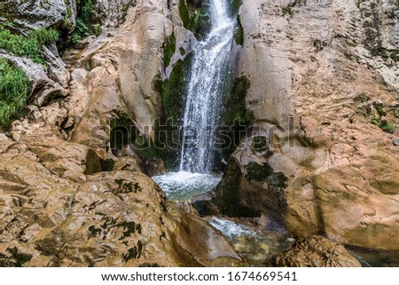 Close up on Horses Waterfall - Cascada Cailor located in Rodna National Park, Rodna Mountains in Maramures region of Romania Royalty-Free Stock Photo #1674669541