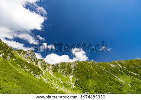 Beautiful mountains with blue sky and pure white clouds