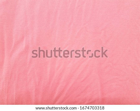 Light pink fabric texture for background or wallpaper.