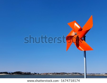 a pinwheel in the sky Royalty-Free Stock Photo #1674718174