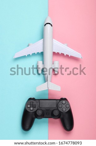 Air game. Gamepad, airplane on a blue-pink pastel background. Top view