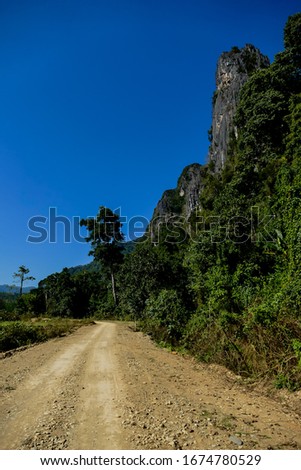road in mountains, digital photo picture as a background , taken in vang vieng, laos, asia