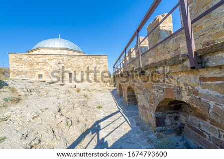 Photos of the Crimean peninsula, Sudak fortress, also called Genoese rock, the fortress was built in 212 by Alans, Khazars or Byzantines, Padishah-Jami Mosque, Museum-Reserve Sudak Fortress Royalty-Free Stock Photo #1674793600