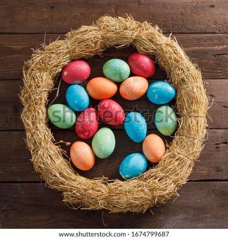 Still life of easter eggs in a bird's nest on a wooden background. Rustic. Decoration of natural. Easter celebration concept. Copy space. Flat lay