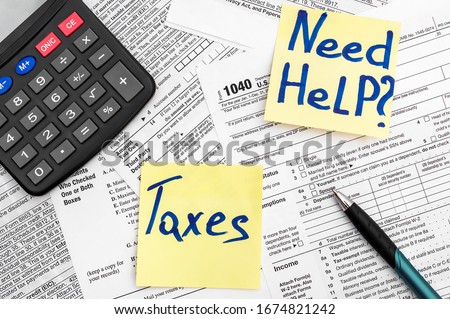 Need help and taxes text on stickers with tax forms. Assistance with filing tax form and calculation. Royalty-Free Stock Photo #1674821242