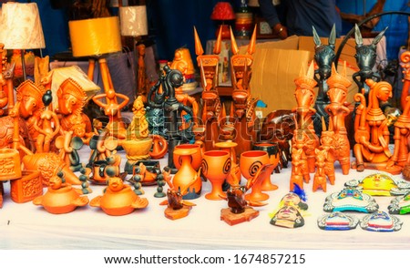 Collection of colorful traditional terracotta sculptures are displayed for selling in handicraft fair. Royalty-Free Stock Photo #1674857215