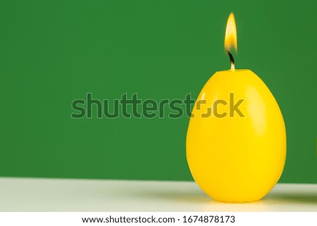 Easter egg candle lightning in studio