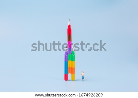 Pencil and man on blue background