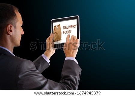 On-line and Internet food delivery concept with a digital tablet