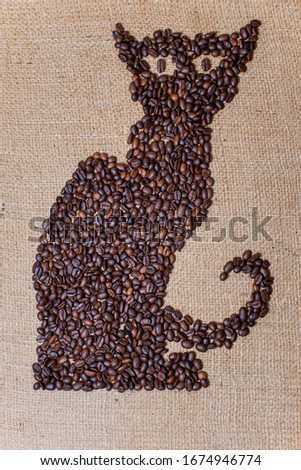 Black cat made of coffee beans