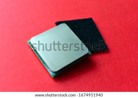 Computer processor on an orange background on both sides
