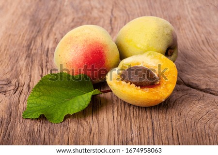 apricots on a dark wooden background. toning. selective focus