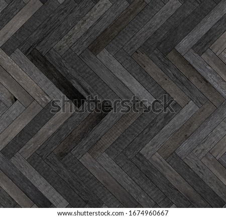 Weathered wood texture for background. Dark seamless wooden floor with herringbone pattern made of thin planks.