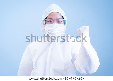 A doctor wearing personal protective equipment or ppe including mask, goggle, and suit to protect COVID-19 infection. coronavirus, medical, healthcare, quarantine concept