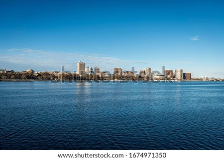 Boston cityscape with river in front in a sunny day