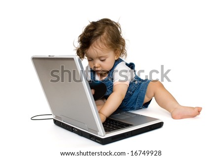 Little girl sitting on laptop,with cd in her hand, isolated