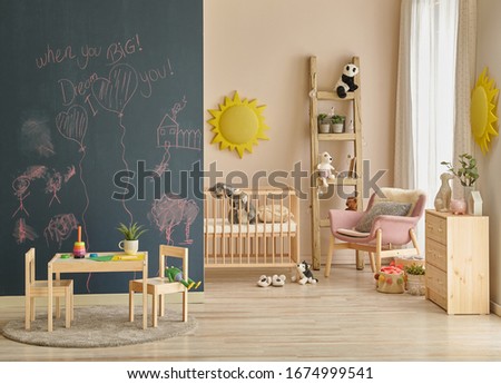 Decorative baby room, black board wall, wooden crib and bed style, decorative stair and toy.