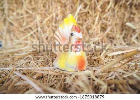 Model of chicken and straw