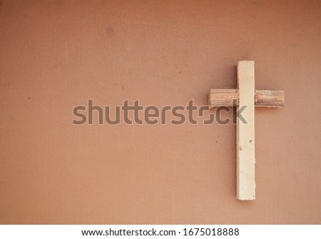 
Wooden cross on a structural background. Day of prayer. Day of Remembrance. Thanksgiving World Prayer Day. Religion.