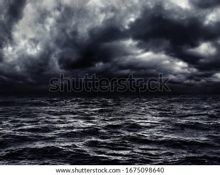 dark stormy sea with a dramatic cloudy sky Royalty-Free Stock Photo #1675098640