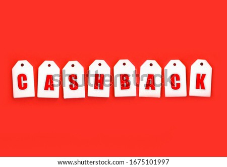 Eight wooden tags with space for text on a red background.