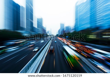 Three dimensional traffic roads and bridges show a very beautiful curve at night. Royalty-Free Stock Photo #1675120159