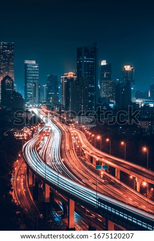 Three dimensional traffic roads and bridges show a very beautiful curve at night.