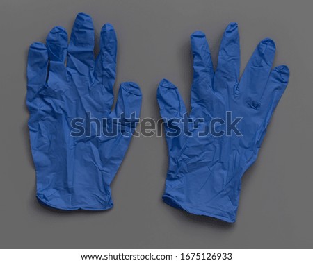 latex blue gloves on a gray background