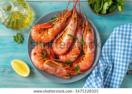 Close up of argentinian red prawns on aqua menthe background