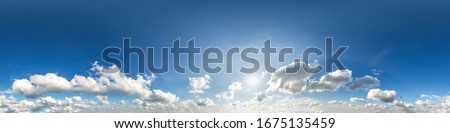 Seamless hdri panorama 360 degrees angle view blue sky with beautiful fluffy cumulus clouds with zenith for use in 3d graphics or game development as sky dome or edit drone shot