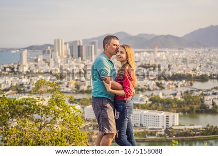 Happy couple tourists on the background of Nha Trang city. Travel to Vietnam Concept