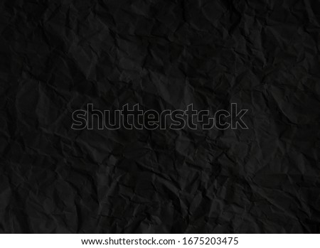 Crumpled black paper texture background Royalty-Free Stock Photo #1675203475