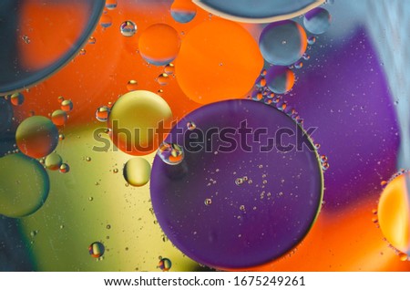 Abstract color background with oil circles.  oil bubbles in water close-up.