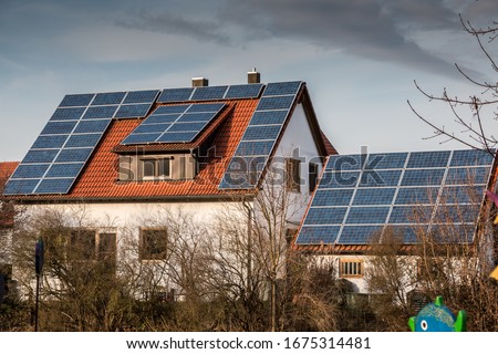 House with a lot of solar panels on the roof Royalty-Free Stock Photo #1675314481