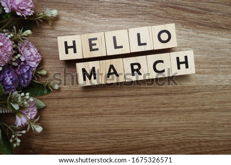 Hello March alphabet letters on wooden background