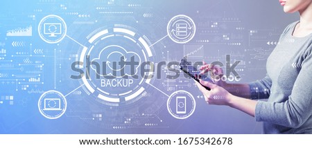 Backup concept with business woman using a tablet computer
