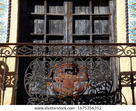 Detail of beautiful forging artistic handrail of a traditional balcony in the city of Ronda. Spain.                                
