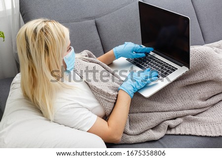 Woman in quarantine for Coronavirus wearing protective mask and smart working Royalty-Free Stock Photo #1675358806