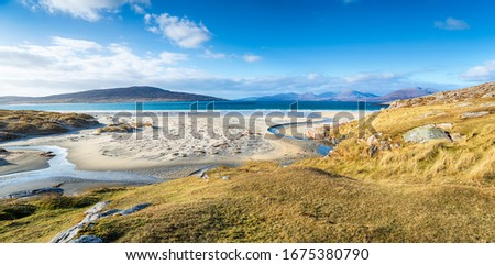 The beautiful sandy beaches at Luskentyre on the Isle of Harris in Scotland Royalty-Free Stock Photo #1675380790