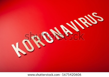koronavirus norsk norwegian word text wooden letter on red background corona virus covid-19 Royalty-Free Stock Photo #1675420606