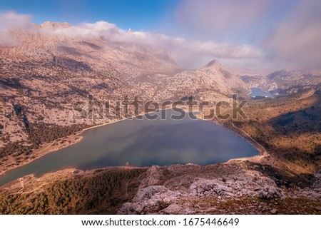 Puig Major with Cuber and Gorg Blau reservoirs, sun and blue skies with low white clouds, Tramuntana, Mallorca, Spain.