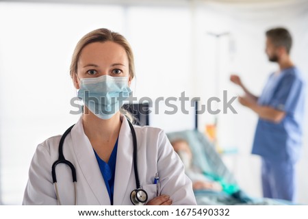 Portrait of doctor in quarantine in hospital, coronavirus concept. Royalty-Free Stock Photo #1675490332