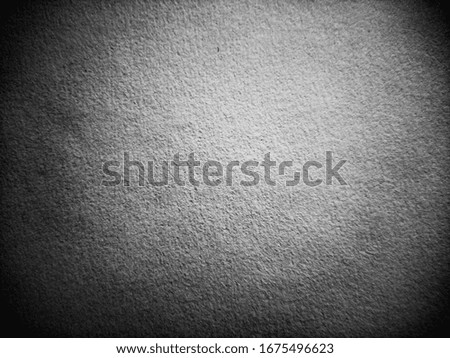 Seamless blurred noisy grainy texture of old paper surface desaturated background backdrop with vignette