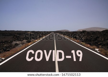 Corona virus uncertain bleak perspective symbol concept and long covid syndrome: Endless road through desert with word covid-19 Royalty-Free Stock Photo #1675502113