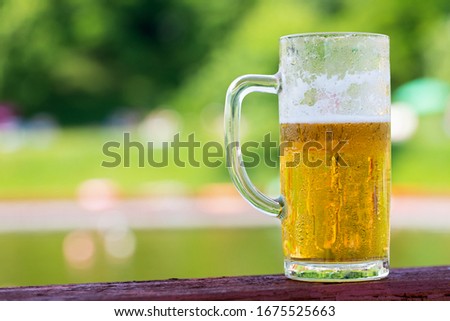 Close up picture of fresh cold draught beer on a restaurant table  