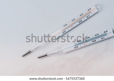 thermometers on white background/Two thermometers on white background/