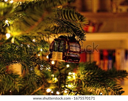 A beautifully decorated Christmas tree with string lights and unique ornaments - Christmas concept
