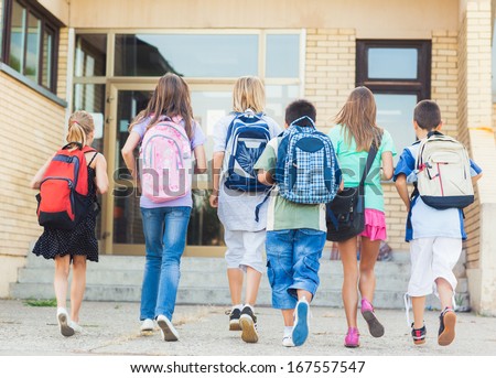 Group of kids going to school together. Royalty-Free Stock Photo #167557547