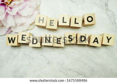 Hello Wednesday alphabet letter with space copy on marble background