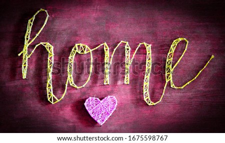 color letters "HOME" on the wooden background